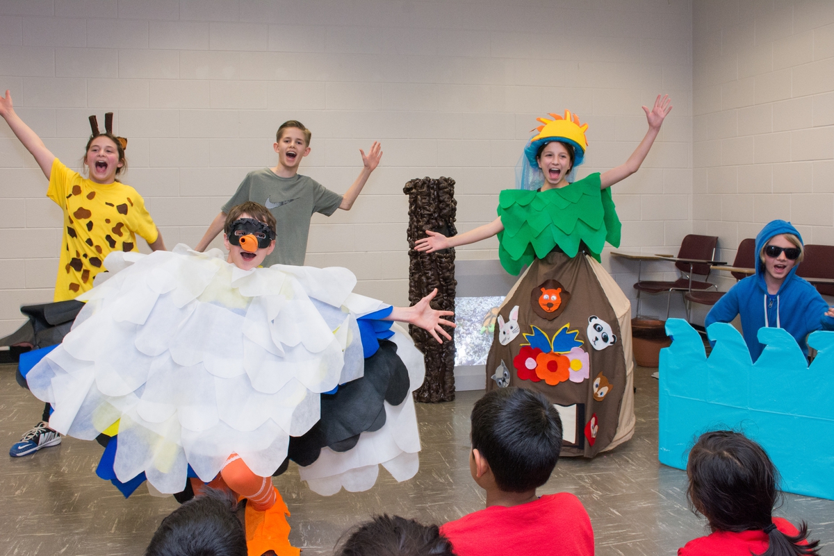 Students performing at a tournament, with very creative costumes